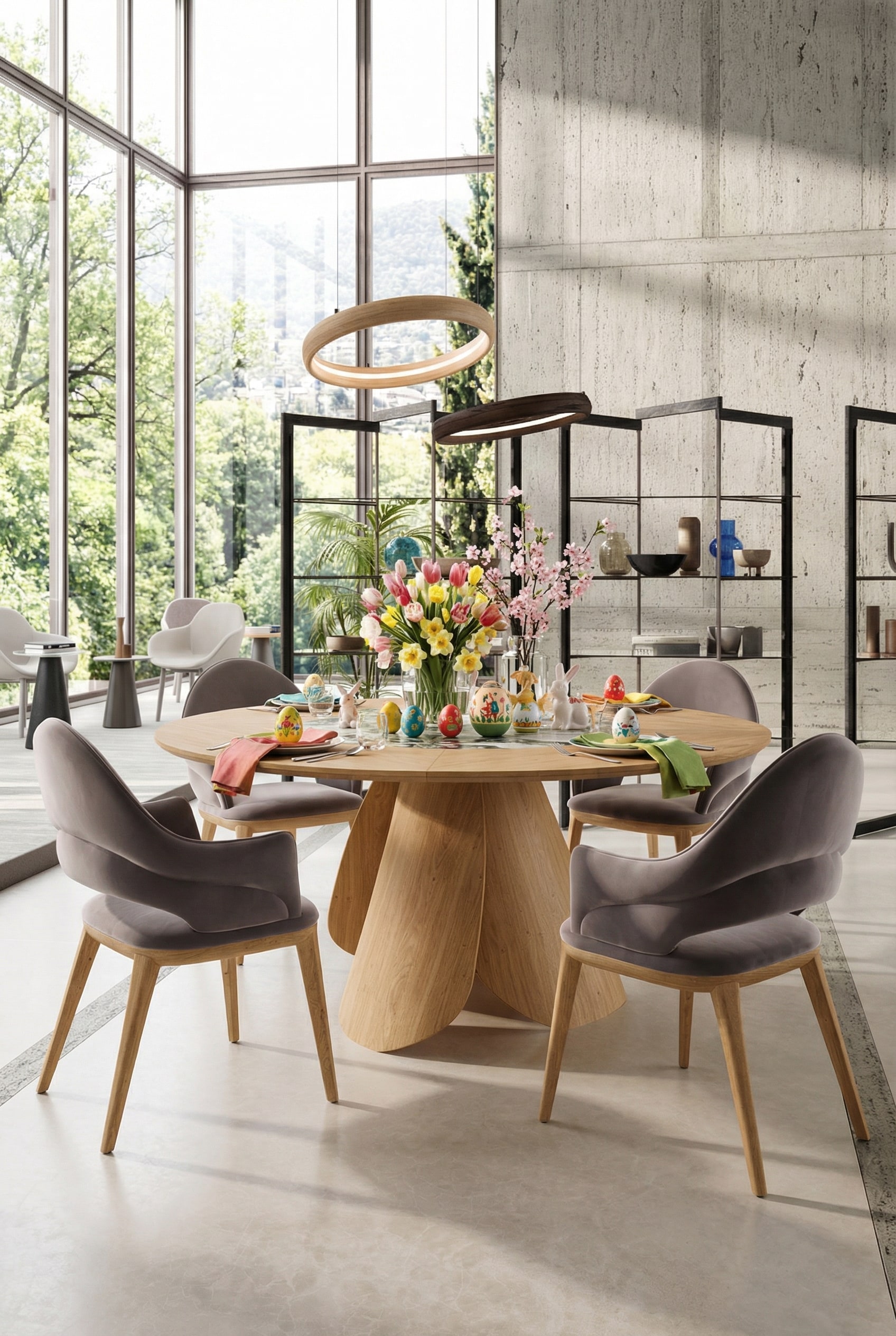 Ozzio Veliero ronde eettafel van licht hout in een lichtdoorstroomde architecten-eetkamer
