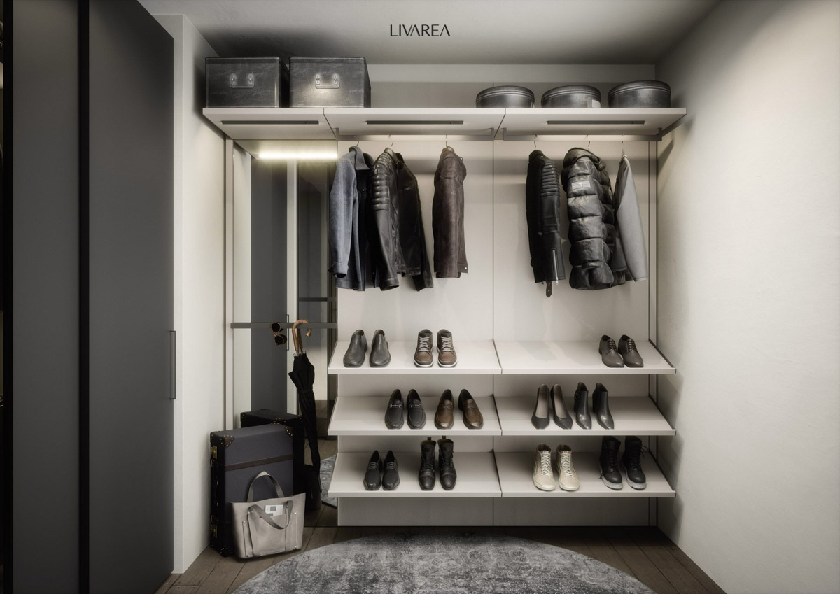 Kleine kleedkamer met aangepaste garderobe met spiegel, schoenenrekken en kledingstangen afgewerkt in witte lak