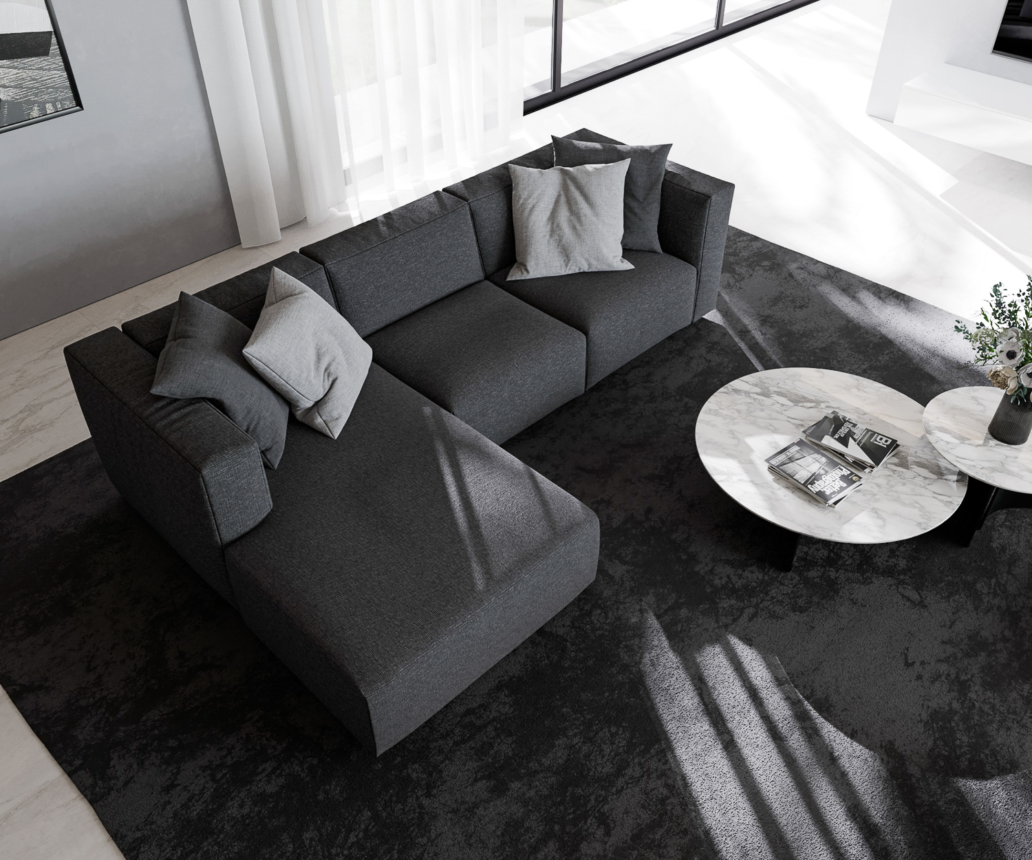 Zwarte Prostoria Sofa Match L met recamiere van boven met salontafel in design flat voor balkonraam 2 zits drie zits Zwarte Prostoria Sofa Match L met recamiere van boven met salontafel in design flat voor balkonraam 2 zits drie zits